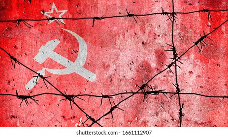 Barbed wire on the background of the flag of the USSR