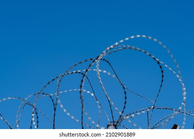 Barbed Wire On Fence With Blue Sky. Southern Border Of The European Union.