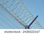barbed wire on the fence of a protected facility in Moscow