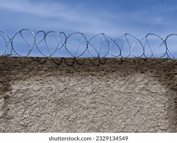 barbed wire on the wall of the house
