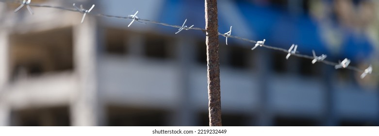 Barbed Wire Stretched Over Fence In Prison. Freedom Crime And Prison Sentence Concept