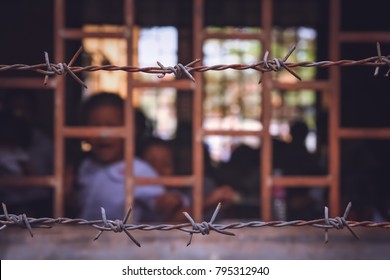 Barbed Wire Surrounding Cambodian School Based In The Former Prison, Phnom Penh, Cambodia