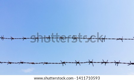 Barbed wire used to replace fences to prevent escaping and not allowing intruders to enter the forbidden area is a barbed wire fence that has been built to prevent climbing over barbed wire