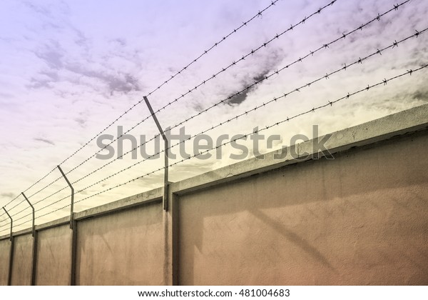 barbed wire wall\
against the sky,\
Backgrounds
