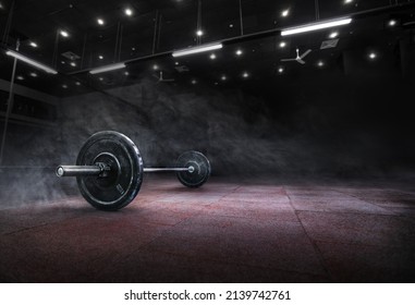 Barbell for fitness training in the gym. Sports background.