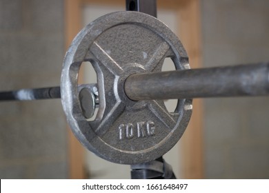 A Barbell On A Squat Rack