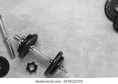 Barbell and parts of one on grey textured background, flat lay. Space for text - Powered by Shutterstock