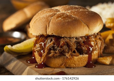Barbeque Pulled Pork Sandwich with BBQ Sauce and Fries