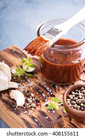 Barbeque Sauce With A Basting Brush In A Jar