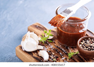 Barbeque Sauce With A Basting Brush In A Jar