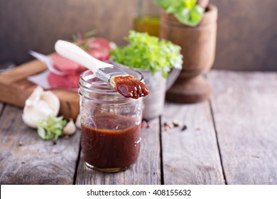 Barbeque Sauce With A Basting Brush In A Jar