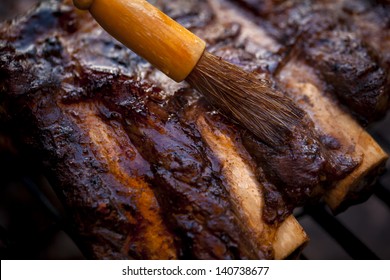 Barbequed Beef Ribs. Beef Ribs Being Roasted On The BBQ