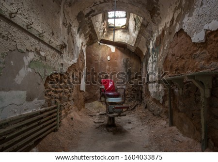 Barber chair in an abandoned prison cell 