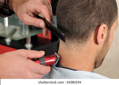 Barber Cutting Hair With Clipper