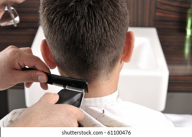 Barber cutting hair with clipper - a series of BARBER images.