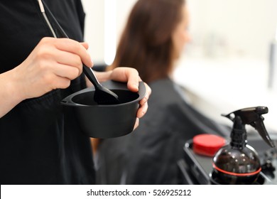 Barber hair dye is applied with a brush - Powered by Shutterstock