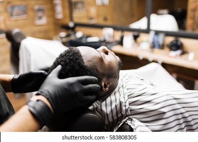 Barber Or Hairdresser Massaging His Client Head