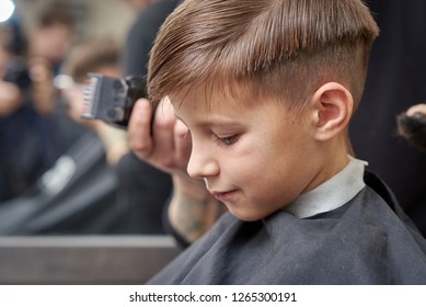 Boy Getting Haircut By Hairdresser Barbershop Stock Photo Edit