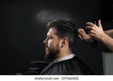 Barber making hairstyle for confident bearded hipster. Advertising for barbershop and men's beauty salon - Shutterstock ID 1975664201