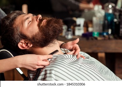 Barber Shaving A Bearded Man, Close-up. Beard Styling And Cut. Vintage Barber Shop. Long Beard. Handsome Bearded Man, Lush Beard. Mens Haircut. Barbershop, Shaving.