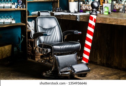 Barber shop chair. Barbershop armchair, barber shop for men. Barber shop pole. Logo of the barbershop, symbol. 