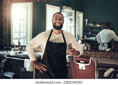 Barber shop, hair clipper and black man portrait of an entrepreneur with a smile. Salon, professional worker and male person face with happiness and proud from small business and beauty parlor