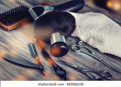 Barber shop tools on old wooden background with copy space