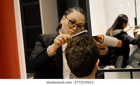 Barber using professional tools to style a client's hair