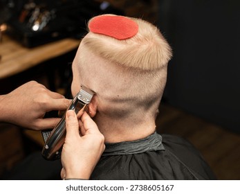 Barber Working on Back of Head with Electric Clippers – Close-Up