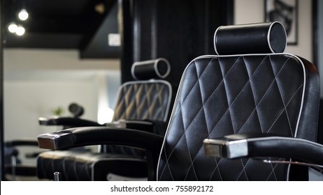 A barber's office. the barber chair inside of a modern barber shop.
