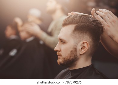Barbershop. Man with beard in barber shop. Modern hair salon
