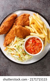 Barberton Fried Chicken With French Fries, Cabbage Salad And Hot Sauce Close Up In The Plate On The Table. Vertical Top View From Above
