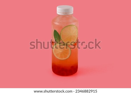 Barbie bubble ice lemonade with tapioca balls with juice, lime, mint on a red background