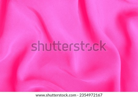 Barbie pink tones textile. Soft fabric folds background