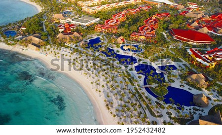 Barcelo Maya Beach Scene, A beautiful seaside Beach and Reflections in Wet Sand with Breaking Waves
Tranquil beach scene. 
Exotic tropical beach landscape for background or wallpaper.