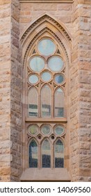 Barcelona, Catalonia, Spain - November 19, 2018: A Stained Glass Window On The Facade Of The Temple Expiatori De La Sagrada Familia (Expiatory Church Of The Holy Family) Front View Closeup