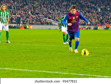 BARCELONA – JAN 15: Leo Messi (R) in a penalty kick during the match between FC Barcelona vs Real Betis, 4 - 2, in Camp Nou stadium on January 15, 2012, Barcelona, Spain.