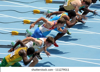 BARCELONA - JULY, 10: Competitors on start of 110m men hurdles during the 20th World Junior Athletics Championships at the Olympic Stadium on July 10, 2012 in Barcelona, Spain