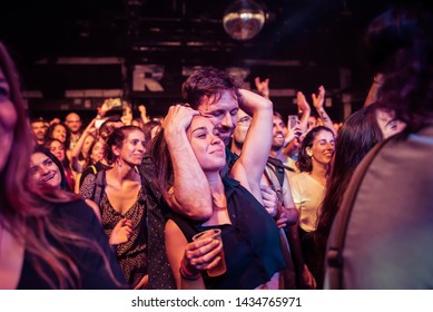 BARCELONA - JUN 22: A Couple From The Crowd Enjoy Together In A Concert At Razzmatazz Stage On June 22, 2019 In Barcelona, Spain.