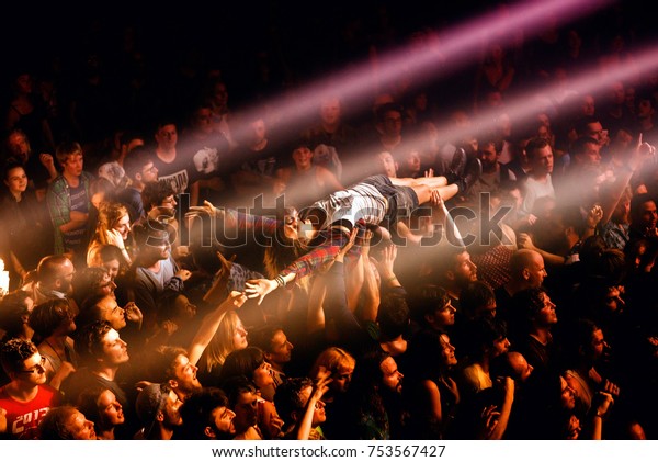 BARCELONA - JUN 5: A fan does crowd surfing with\
the crowd in a concert at Primavera Sound 2016 Festival on June 5,\
2016 in Barcelona,\
Spain.