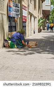 Barcelona, ​​SPAIN - JUNE 20, 2022: Homeless Person Begging In The Streets Of Barcelona