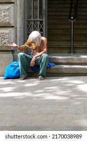 Barcelona, ​​SPAIN - JUNE 20, 2022: Homeless Person Begging In The Streets Of Barcelona