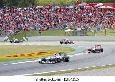 BARCELONA - MAY 13: Some cars racing at the race of Formula One Spanish Grand Prix at Catalunya circuit, on May 13, 2012 in Barcelona, Spain. The winner was Pastor Maldonado of Williams Renault team.