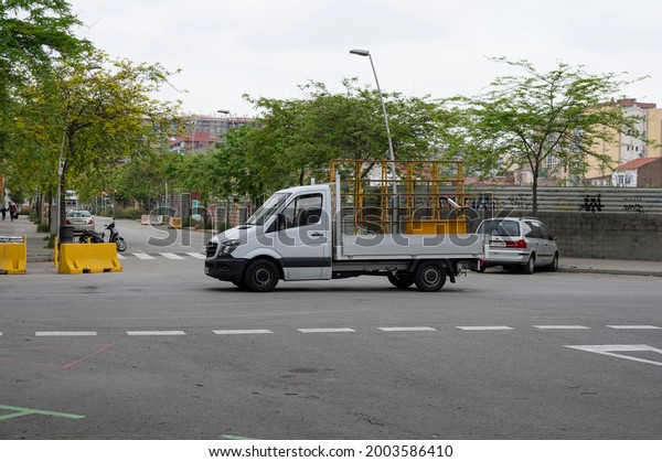 Barcelona, ​​Spain; May 6, 2021:\
Work van from a shop window. It\'s a Mercedes Benz Sprinter 906\
van
