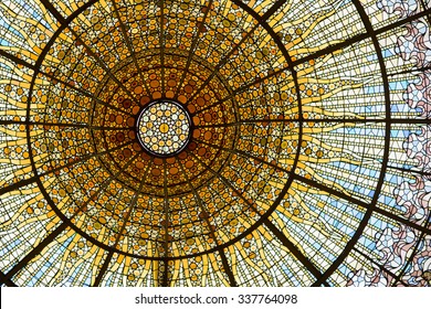 BARCELONA - SEP 22: Palau de la Musica Catalana skylight of stained glass designed by Antoni Rigalt whose centerpiece is an inverted dome in shades of gold, on September 22, 2015 in Barcelona.