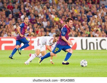 BARCELONA - SEPTEMBER 13: Leo Messi (R) In Action During The UEFA Champions League Match Between FC Barcelona And AC Milan, Final Score 2 - 2, On September 13, 2011, In Barcelona, Spain.