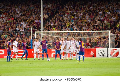 BARCELONA - SEPTEMBER 13: Leo Messi (10) Shoots A Free Kick During The Champions League Match Between FC Barcelona And Milan, Final Score 2 - 2, On September 13, 2011, In Camp Nou, Barcelona, Spain.