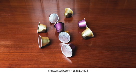 Barcelona, Spain - 13-11-2020: Nespresso Capsules, L'or And Starbucks Brand Top View Isolated On Dark Wooden Background. Coffee Machine With Capsules