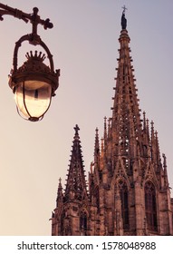 Barcelona, Spain - 26th October 2019: Barcelona Cathedral Tower View With Street Lights Off, At Sunrise. Golden Hour