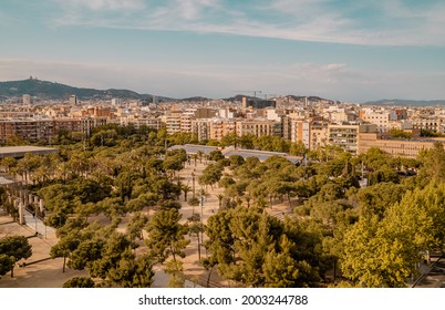 Barcelona, Spain - April 15, 2021 - panoramic aerial sunset view of the Park Joan Miro with the cityscape of downtown Barcelona